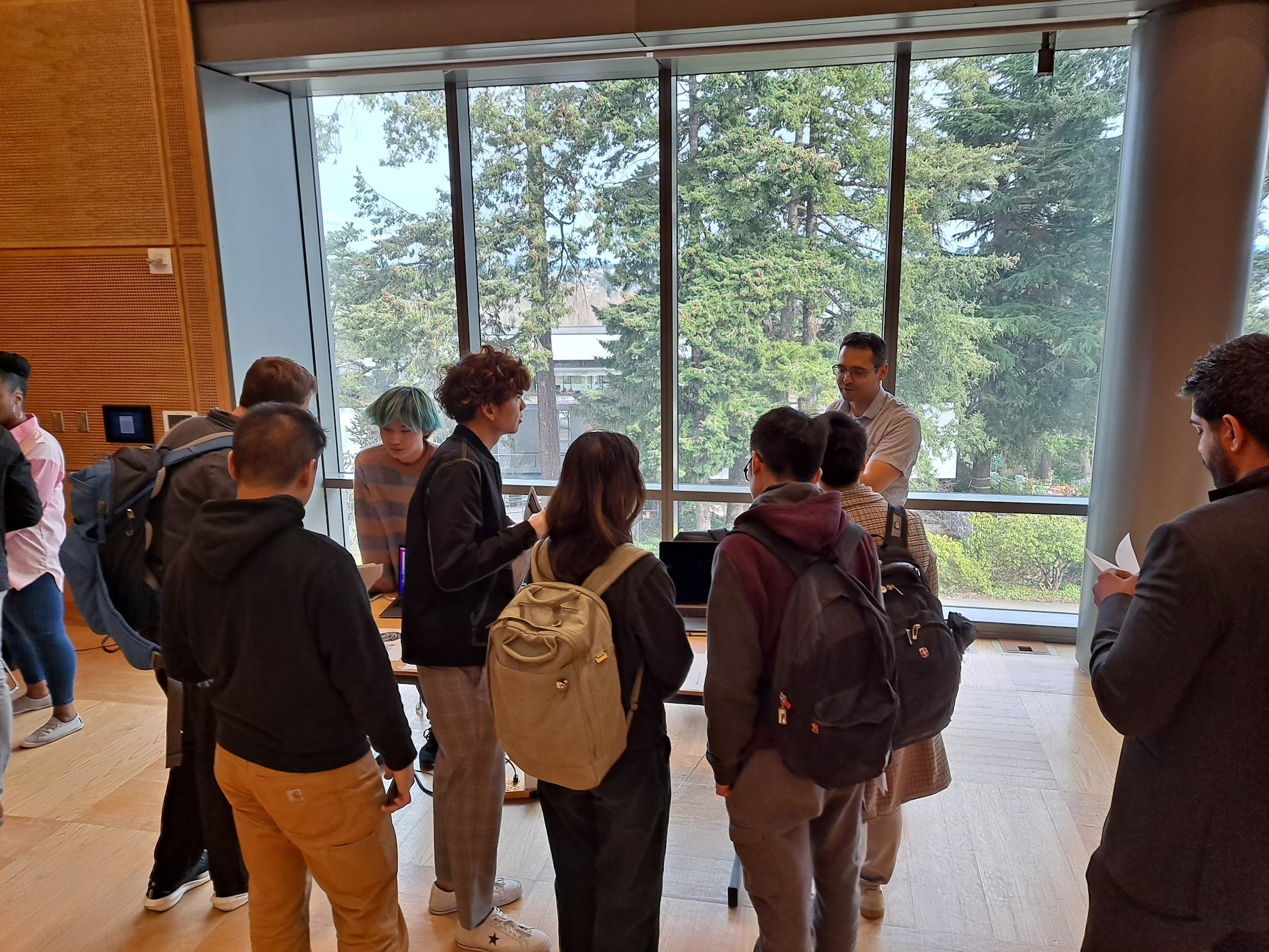 Group of students talking to a recruiter